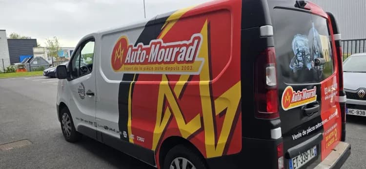 Semi covering Trafic Auto Mourad, detail logo